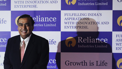 Mukesh Ambani, chairman of Reliance Industries Limited, poses for photographers before addressing the annual shareholders meeting in Mumbai June 6, 2013.