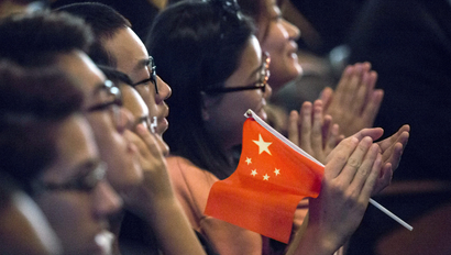 Students clap while Chinese President Xi Jinping delivers a speech during a visit to Lincoln High School in Tacoma, Washington, September 23, 2015.