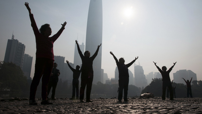 DATE IMPORTED:February 12, 2015Residents do morning exercises at a park on a hazy day in Shenzhen, Guangdong province February 12, 2015. Nearly 90 percent of China's big cities failed to meet air quality standards in 2014, but that was still an improvement on 2013 as the country's "war on pollution" began to take effect, the environment ministry said on February 2. REUTERS/Stringer