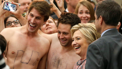 U.S. Democratic presidential candidate Hillary Clinton takes a photo with supporters John Nelson, 32, (L) and Dan Stifler, 32, (C) after speaking at the UFCW Union Local 324 in Buena Park, California, U.S. May 25, 2016.