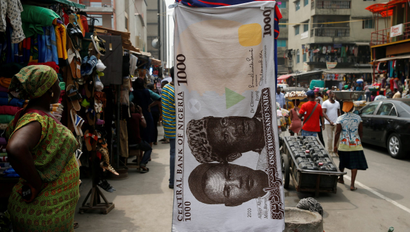 A towel designed with a print of the 1000 Nigeria naira in the middle of a street