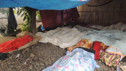 Bodies of victims in the brazen attack by about 40 to 50 Abu Sayyaf militants are covered in blankets at a makeshift morgue in Talipao township in Jolo in southern Philippines