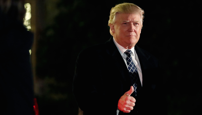 Donald Trump gives a thumbs up to the media
