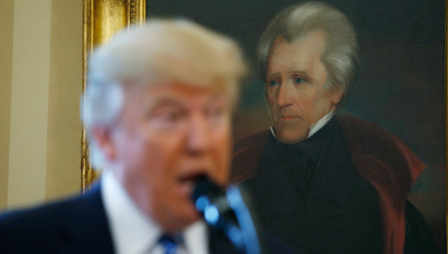 U.S. President Donald Trump speaks in front of a portrait of former U.S. President Andrew Jackson