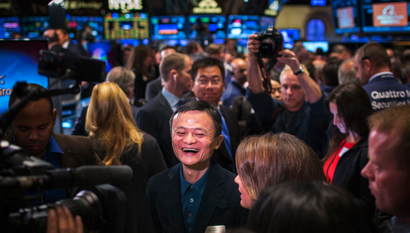 Alibaba Group Holding Ltd. founder Jack Ma reacts on the floor of the New York Stock Exchange before the company's initial public offering (IPO) under the ticker "BABA", in New York September 19, 2014. Alibaba Group Holding Ltd's shares surged by more than 40 percent in their first day of trading on Friday as investors jumped in to buy what looks likely to be the largest IPO in history. REUTERS/Lucas Jackson (UNITED STATES - Tags: BUSINESS SCIENCE TECHNOLOGY TPX IMAGES OF THE DAY) - RTR46YF6
