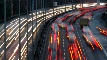 Car light trails are pictured as traffic drives along a highway during a nationwide railway strike in Berlin November 15, 2007. German train drivers escalated a 62-hour strike early on Thursday, adding disruption to passenger services to a freight stoppage in a long-running dispute with rail operator Deutsche Bahn. The strike, which has raised fears about the impact on Europe's biggest economy, is the worst in Deutsche Bahn's history. REUTERS/Fabrizio Bensch (GERMANY) - RTXI0L