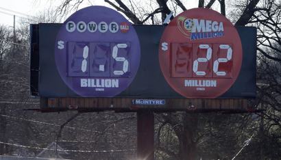 Drivers pass a billboard where the word "billion" has replaced "million" to show the correct amount of the jackpot for Wednesday night's Powerball drawing on Wednesday, Jan. 13, 2016, in Nashville, Tenn. The top prize, now at more than $1 billion, is the largest lottery jackpot in the world. (AP Photo/Mark Humphrey)