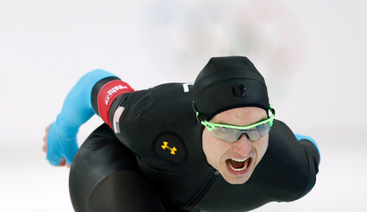 Jonathan Kuck of the U.S. competes in the men's 1,500 metres speed skating race during the 2014 Sochi Winter Olympics, February 15, 2014. U.S. speed-skaters decided on Friday to drop new, specially designed Under Armour Inc suits that media reports have linked to a dismal showing at the Sochi Games, reverting to apparel worn during recent World Cup events. REUTERS/Issei Kato (RUSSIA - Tags: OLYMPICS SPORT SPEED SKATING) - RTX18VKT