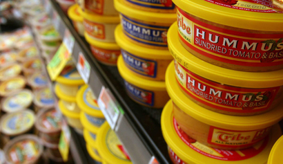 Hummus, once sparse or even non-existent at the local grocer, now often fills an entire refrigerator case like this one at Shaw's supermarket in Concord, N.H. on Tuesday, February 20, 2007