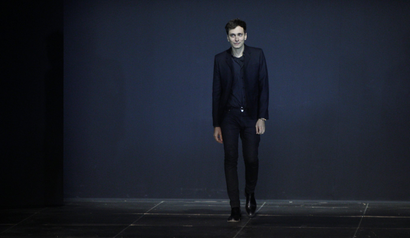 French designer Hedi Slimane appears at the end of his Spring/Summer 2013 women's ready-to-wear fashion show for French fashion house Saint Laurent Paris during Paris fashion week October 1, 2012. REUTERS/Gonzalo Fuentes (FRANCE - Tags: FASHION) - LR1E8A11M75HB