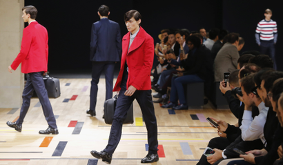 Models wear creations by Belgian designer Kris Van Assche as part of Dior Homme mens Spring-Summer 2015 fashion collection, presented in Paris, Saturday, June 28, 2014. (AP Photo/Jacques Brinon)