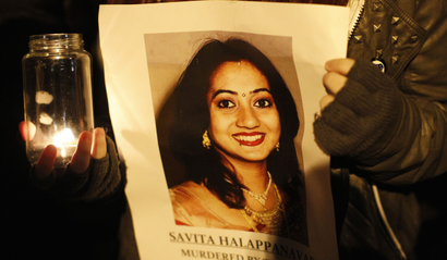 Activist holding photo of Savita Halappanavar