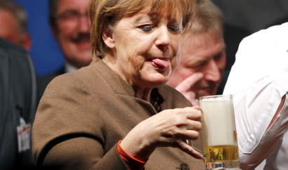 German Chancellor Merkel drinks beer during CDU political Ash Wednesday meeting in Volkmarsen