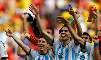 Argentina's Lionel Messi and teammates celebrate winning the 2014 World Cup quarter-finals between Argentina and Belgium at the Brasilia national stadium in Brasilia July 5, 2014. REUTERS/Dominic Ebenbichler (BRAZIL - Tags: TPX IMAGES OF THE DAY SOCCER SPORT WORLD CUP) TOPCUP