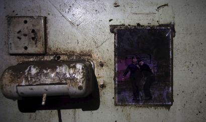 A picture is seen on the wall of a crew member dormitory inside the capsized Eastern Star cruise ship.