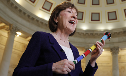 Sen. Susan Collins, R-Maine, who moderated bipartisan negotiations holds her walking stick