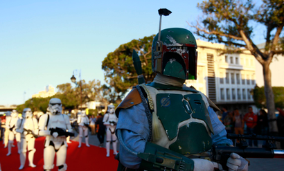 A man dressed up as Boba Fett from the Star Wars movies takes part in a parade as part of a tourism event at Habib Bourguiba Avenue in Tunis April 30, 2014. The event, organized by Tunisia's national tourism office, featured a parade of Star Wars characters before screenings of the films. Tunisia was one of the filming locations for the movies. REUTERS/Anis Mili (TUNISIA - Tags: ENTERTAINMENT TRAVEL SOCIETY) - RTR3NC0K