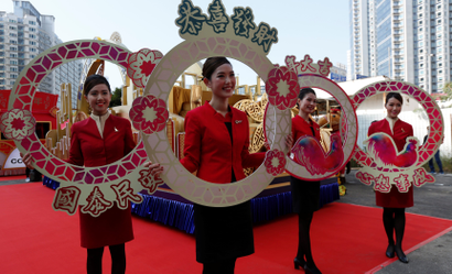 Flight attendants from Cathay Pacific Airways take part in the upcoming Chinese New Year parade during a rehearsal in Hong Kong, China January 25, 2017. REUTERS/Bobby Yip - RTSX8TN