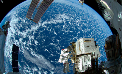 NASA astronaut Reid Wiseman and European Space Agency astronaut Alexander Gerst (not shown) works outside the space station's Quest airlock in the first of three spacewalks for the Expedition 41 crew aboard the International Space Station in this image released October 8, 2014. The spacewalkers worked outside the space station's Quest airlock for 6 hours and 13 minutes, relocating a failed cooling pump to external stowage and installing gear that provides back up power to external robotics equipment. REUTERS/Alexander Gerst/NASA/ESA/Handout (OUTER SPACE - Tags: SCIENCE TECHNOLOGY) FOR EDITORIAL USE ONLY. NOT FOR SALE FOR MARKETING OR ADVERTISING CAMPAIGNS. THIS IMAGE HAS BEEN SUPPLIED BY A THIRD PARTY. IT IS DISTRIBUTED, EXACTLY AS RECEIVED BY REUTERS, AS A SERVICE TO CLIENTS - RTR49EJF