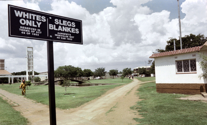 A sign reads "Whites only / Slegs Blankes" in the empty mining town of Carletonville, South Africa, in 1989.