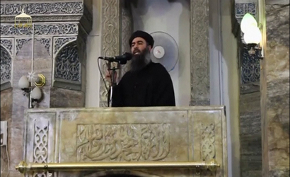 A man purported to be the reclusive leader of the militant Islamic State Abu Bakr al-Baghdadi has made what would be his first public appearance at a mosque in the centre of Iraq's second city, Mosul, according to a video recording posted on the Internet on July 5, 2014, in this still image taken from video. There had previously been reports on social media that Abu Bakr al-Baghdadi would make his first public appearance since his Islamic State in Iraq and the Levant (ISIL) changed its name to the Islamic State and declared him caliph. The Iraqi government denied that the video, which carried Friday's date, was credible. It was also not possible to immediately confirm the authenticity of the recording or the date when it was made. REUTERS/Social Media