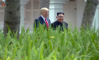In this image made from video released by KRT on June 14, 2018, shows North Korean leader Kim Jong Un, right, walking with U.S. President Donald Trump in the garden during their summit in Singapore, June 12, 2018. Through the state-run media's edited footage of the summit that aired in their country Thursday, North Koreans are getting a new look at U.S. President Donald Trump now that his summit with leader Kim Jong Un is safely over and it's a far cry from the "dotard" label Pyongyang slapped on him last year.