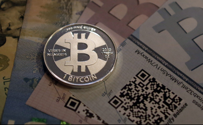 One of Bitcoin enthusiast Mike Caldwell's coins in this photo illustration at his office in Sandy, Utah