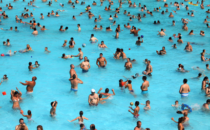 People crowd a swimming pool to cool off during a hot summer day in Belgrade July 17, 2010.