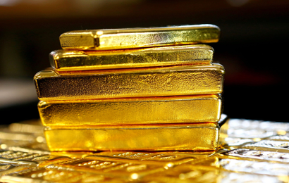Several stacked gold bars.