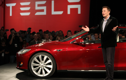 Tesla Motors CEO Elon Musk speaks next to the company's newest Model S during the Model S Beta Event held at the Tesla factory in Fremont, California October 1, 2011. The Model S is the company's first full-size electric sedan set for release in 2012. REUTERS/Stephen Lam (UNITED STATES - Tags: TRANSPORT BUSINESS LOGO SCIENCE TECHNOLOGY) - RTR2S40H