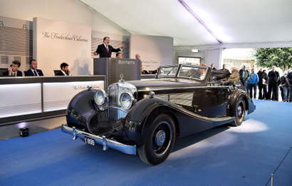 People look at an antique car from the Frederiksen Collection which are up for auction through the British auction house Bonhams, at Mr. Frederiksens manor in Mols Bjerge national park, eastern Jutland, Denmark September 26, 2015. The single-owned collection consists of 48 rare and iconic motor cars, all offered at the auction taking place at the home of owner Henrik Frederiksen. The sale features predominantly pre-war motor cars, built by some of the worlds most exclusive manufacturers, including Rolls-Royce, Bentley, Mercedes-Benz, Lagonda and Maybach. ATTENTION EDITORS - THIS IMAGE WAS PROVIDED BY A THIRD PARTY. FOR EDITORIAL USE ONLY. NOT FOR SALE FOR MARKETING OR ADVERTISING CAMPAIGNS. THIS PICTURE IS DISTRIBUTED EXACTLY AS RECEIVED BY REUTERS, AS A SERVICE TO CLIENTS. DENMARK OUT. NO COMMERCIAL OR EDITORIAL SALES IN DENMARK. NO COMMERCIAL SALES. - GF10000222116