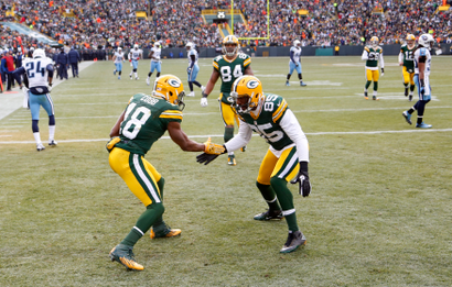 Green Bay Packers wide receiver Randall Cobb (L) celebrates his touchdown against the Tennessee Titans.