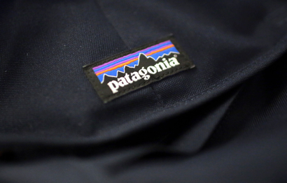 A Patagonia logo is sewn on a backpack Wednesday, Nov. 28, 2018, in New York. Patagonia, the outdoor gear company, is passing along the $10 million it saved from tax cuts to non-profit environmental groups. (AP Photo/Wong Maye-E)