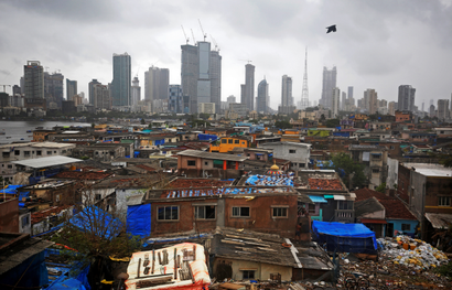 Mumbai slums contrasted against the city's business district