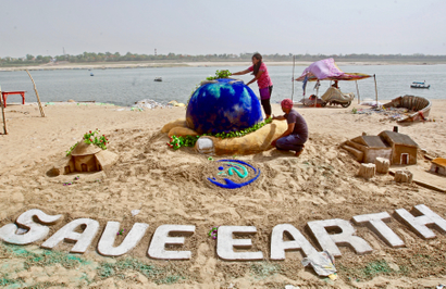 Earth Day 2018 sand sculpture on the banks of the river Yamuna in Allahabad, India.