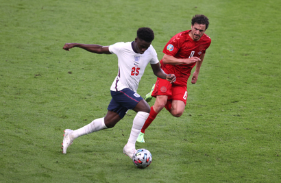 Bukayo Saka playing for England against Denmark.