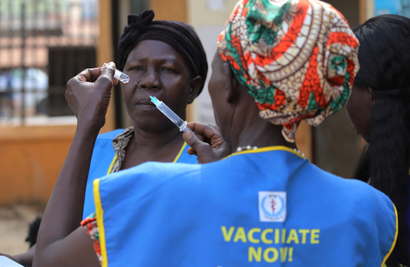 South Sudanese health workers prepare to administer vaccination. Global vacconation rates have fallen because of Covid-19.
