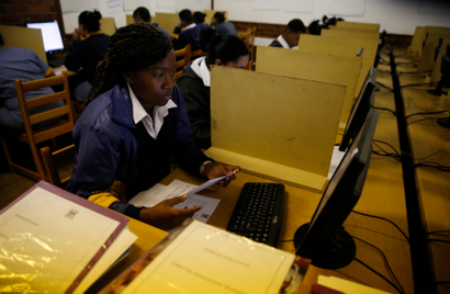 Students in a South African high school working on desktops.