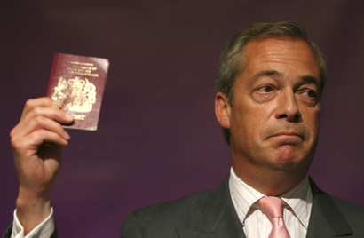 Nigel Farage holding a passport