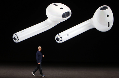 AirPods are displayed as Apple Inc CEO Tim Cook makes his closing remarks during an Apple media event in San Francisco, California, U.S.