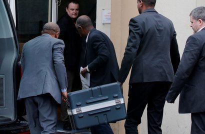 Men unload a case containing the black boxes from the crashed Ethiopian Airlines Boeing 737 MAX 8 outside the headquarters of France's BEA air accident investigation agency in Le Bourget, north of Paris, France, March 14, 2019.