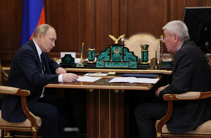 Russian President Vladimir Putin meets with head of Federal Financial Monitoring Service Yury Chikhanchin in Moscow.