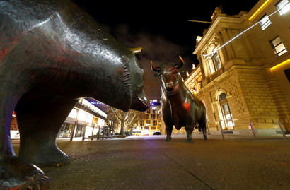 Bull and bear symbols for successful and bad trading are seen in front of the German stock exchange