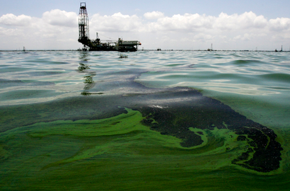 Oil spill on water is seen near an oil production facility at Maracaibo lake near the coastal town of Barranquitas August 15, 2011.