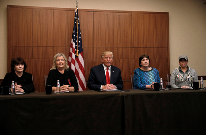 Republican presidential nominee Donald Trump sits with (from R-L) Paula Jones, Kathy Shelton, Juanita Broaddrick, Kathleen Willey in a hotel conference room in St. Louis, Missouri, U.S., shortly before the second presidential debate at Washington University in St. Louis, October 9, 2016.