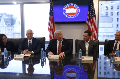 U.S. President-elect Donald Trump (C) sits with Vice President-elect Mike Pence (2ndL) PayPal co-founder and Facebook board member Peter Thiel (2ndR), Apple Inc CEO Tim Cook (R) and Facebook COO Sheryl Sandberg during a meeting with technology leaders at Trump Tower in New York, U.S., December 14, 2016. REUTERS/Shannon Stapleton - RTX2V2W7