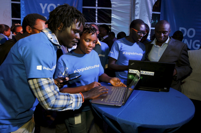 Microsoft delegates check applications in a computer during the launch of the Windows 10 operating system in Kenya's capital Nairobi