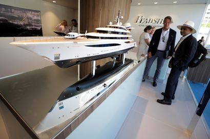 A visitor attends the Monaco Yacht show, one of the most prestigious pleasure boat shows in the world, highlighting hundreds of yachts for the luxury yachting industry in port of Monaco, September 26, 2018.