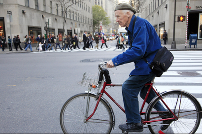 New York Times photographer Bill Cunningham bicycles to work, Tuesday, Nov. 23, 2010 in New York. (AP Photo/Mark Lennihan)