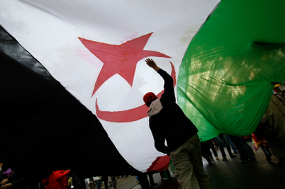 Protesters carry a Western Sahara flag during a demonstration in support of independence for Western Sahara in Madrid